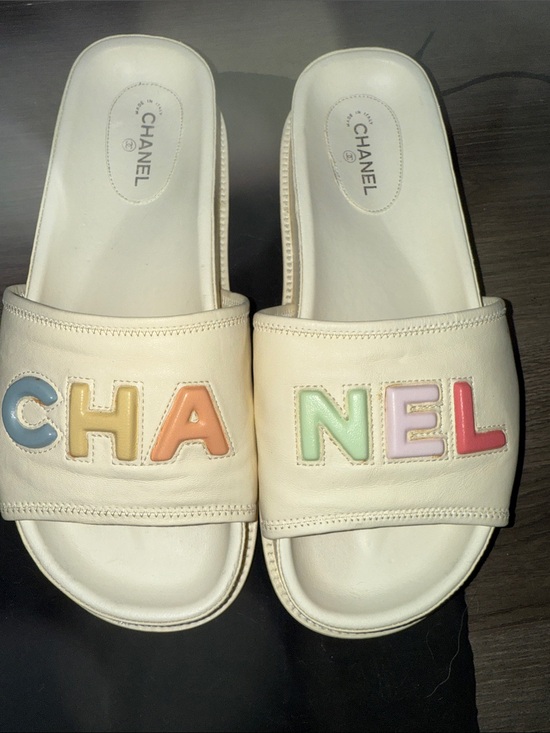 CHANEL Shoes - CHANEL Cream Leather Slide Sandals with Multicolor Pastel Logo